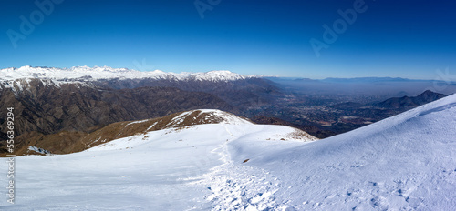 Snowy Mountain Peak with Panoramic Valley View