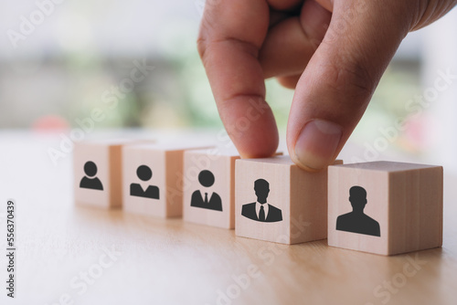 Job recruitment concept. Putting wooden cubes on target customer symbols. Target customer, buyer persona, marketing segmentation, Personalization marketing, and customer-centric strategies. photo