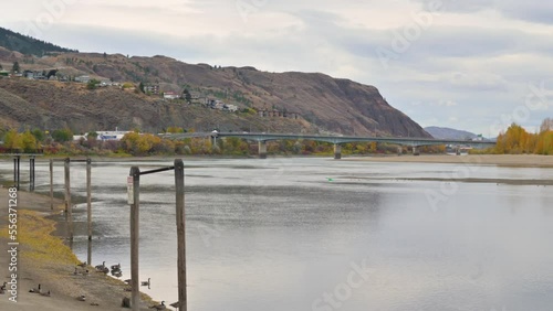 Wallpaper Mural During a cloudy fall day in downtown Kamloops, a panoramic view overlooks the Thompson River with cars driving on the Overlanders Bridge in the distance Torontodigital.ca