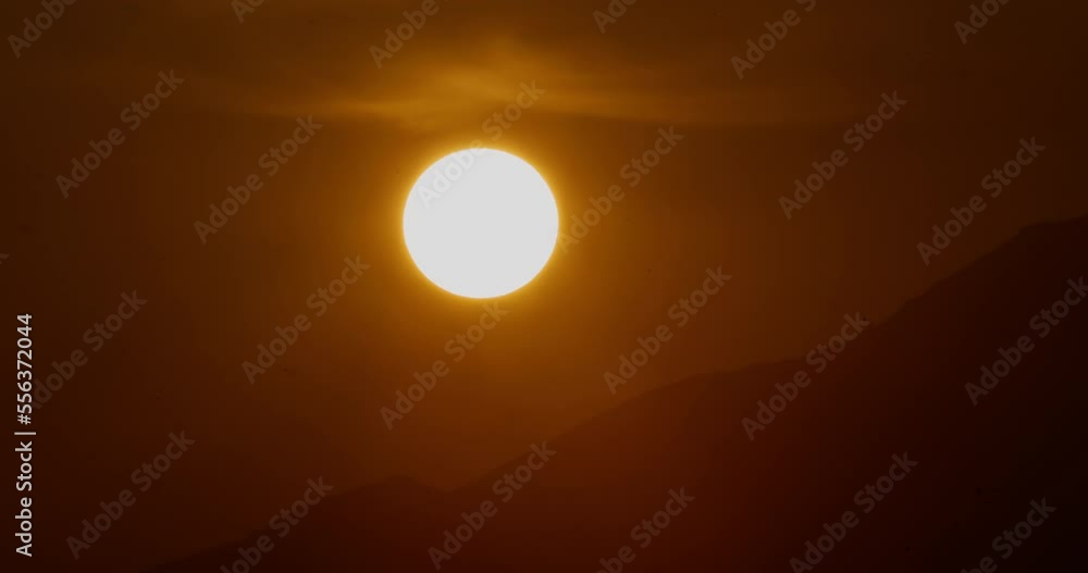 big sun sunset timelapse, majestic Big Red Hot Sun in mountainous area, the end of something concept, golden hour telephoto lens shot big sun sunset timelapse, majestic Big Red Hot Sun in mountainous area, the end of something concept, golden hour telephoto lens shot