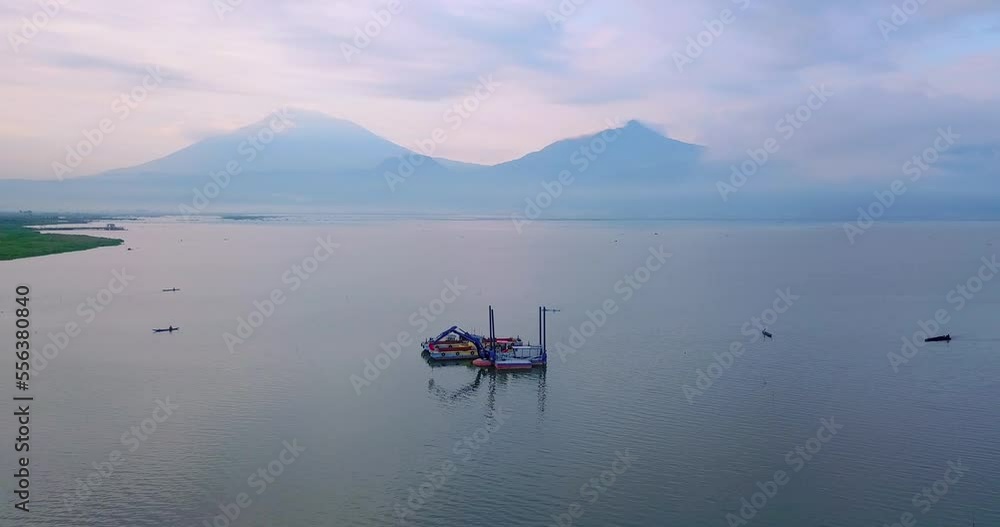 Panorama drone shot of Dredger Boat on Rawa Pening Lake in Indonesia in the evening Panorama drone shot of Dredger Boat on Rawa Pening Lake in Indonesia in the evening
