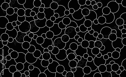 Many white circles on black background