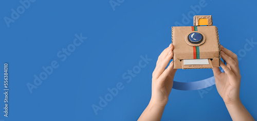 Female hands with cardboard...
