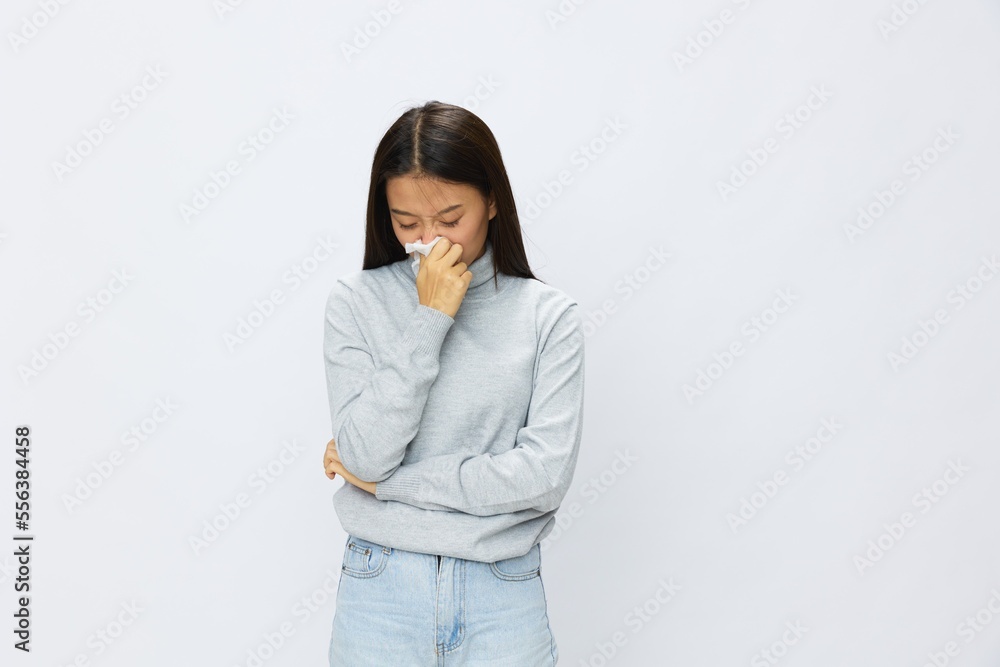 Asian woman holding hand with handkerchief and coughing up flu and cold, stuffy nose viral disease asthma and allergies covid, white background Asian woman holding hand with handkerchief and coughing up flu and cold, stuffy nose viral disease asthma and allergies covid, white background