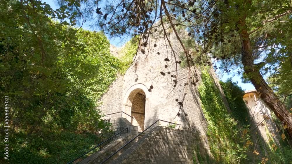 View Of Steps Leading To Walled Tower In The Old Town In Ioannina On Sunny Day. Pan Down Shot View Of Steps Leading To Walled Tower In The Old Town In Ioannina On Sunny Day. Pan Down Shot