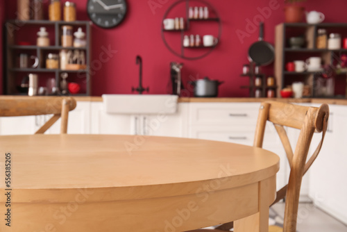 Wooden dining table and chairs in modern kitchen