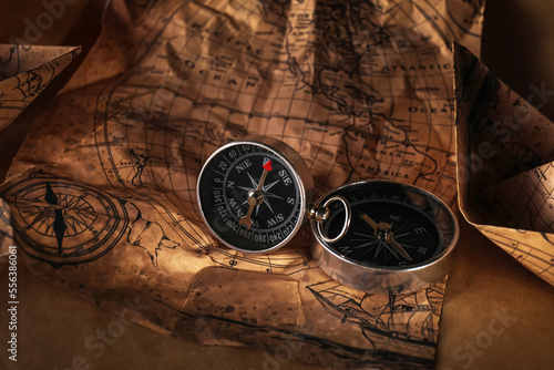 Small compasses on world map