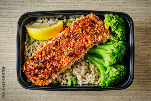Delicious and healthy salmon lunch meal with rice and broccoli