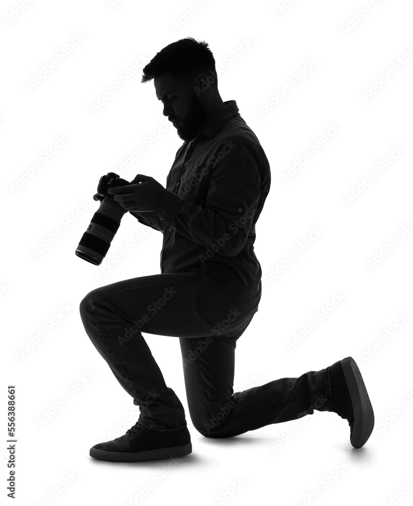 Silhouette of male photographer with camera on white background Silhouette of male photographer with camera on white background