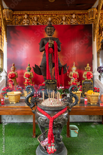 Bangkok, Thailand, November 27, 2022. Wat Krathum Suea Pla.  Inside the museum, the principal body of a Buddha statue 80. And surrounded by 80 smaller Lord Buddha in various postures. photo