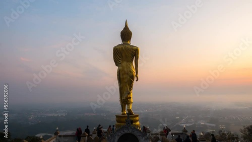 Time Lapse of The Golden buddha in sunrise. Aerial view sunrise at Wat Phra That Kao Noi in Nan Province , Thailand. Time Lapse Sunrise Buddha and Sea of Fog