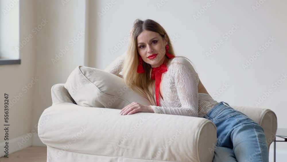 Beautiful long hair blonde woman looking to camera with smile. Studio close-up portrait. Fashion, beauty and make-up concept Beautiful long hair blonde woman looking to camera with smile. Studio close-up portrait. Fashion, beauty and make-up concept