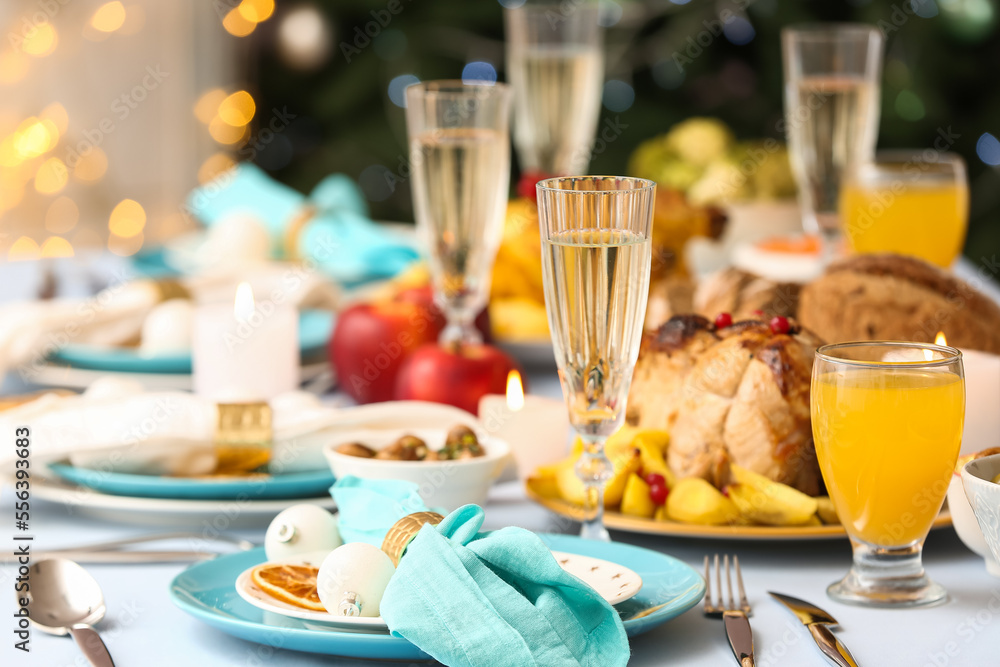 Tasty dishes and drinks for Christmas dinner on table