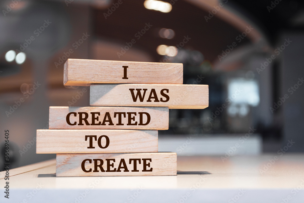 Wooden blocks with words 'I was created to create'.