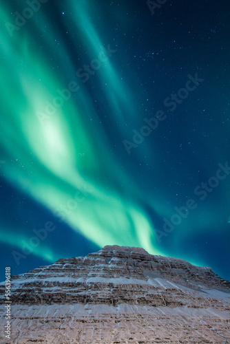 Mountain and aurora borealis at night landscape photo. Beautiful nature scenery photography with sky on background. Idyllic scene. High quality picture for wallpaper, travel blog, magazine, article © Gypsy On The Road