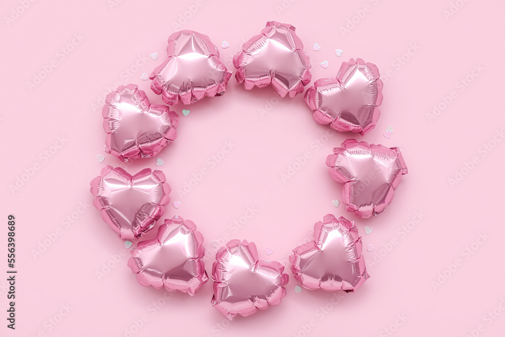 Obraz premium Frame made of heart-shaped balloons on pink background. Valentine's Day celebration