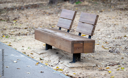 Wooden benches in the park. City park architecture.