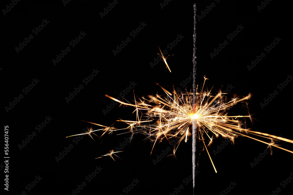 burning sparkler, bengal lights on a black background