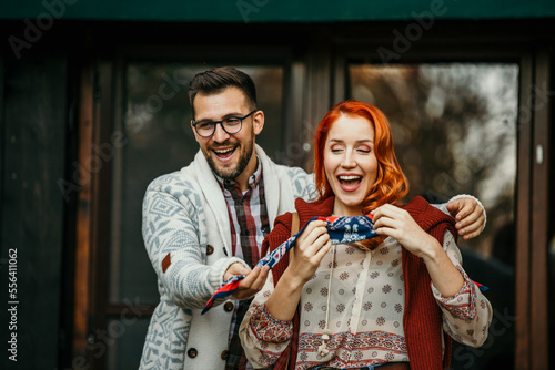 Host woman and man surprised their friends during a garden party.