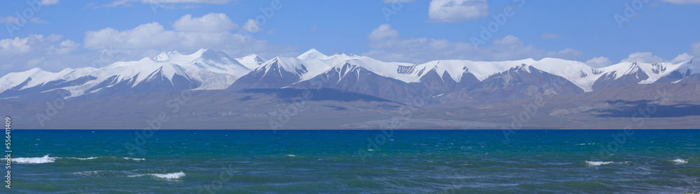 Panorama view of snow mountains and glacier lake under blue sky in tibet,China