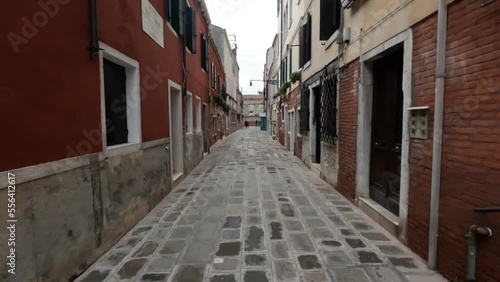 01-12-2022. Venice - Italy. An ancient alley in the Cannaregio district of Venice - Italy. Against a cloudy winter sky.