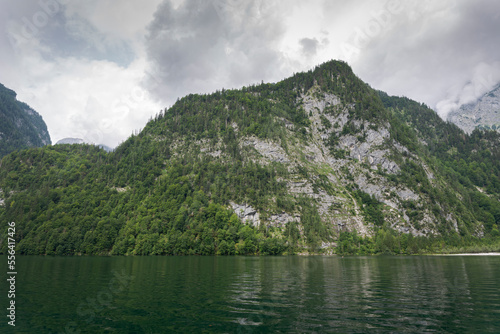 The K  nigssee  a natural lake in the extreme southeast Berchtesgadener Land district of the German state of Bavaria  near the Austrian border.