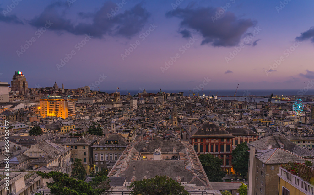 Genoa old city at sunset from Spianata Castelletto in Italy.