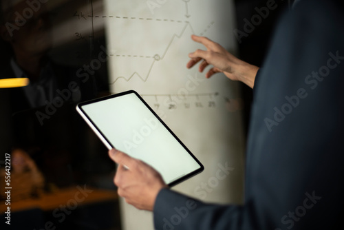 Close up of man using digital tablet.