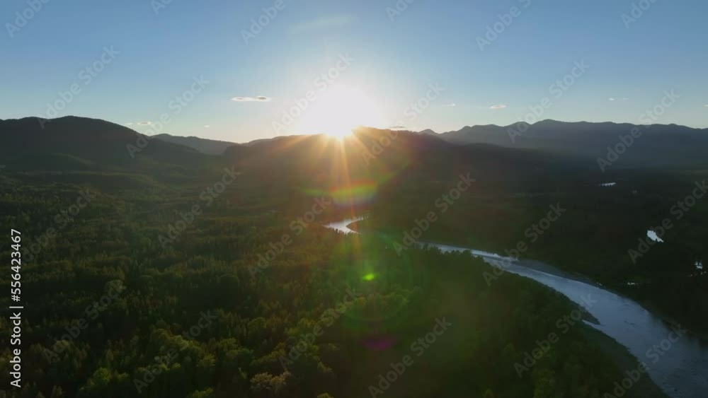 Dramatic Scene Of Sunburst Over Mountains In Flathead River Near Glacier National Park In Montana, United States. Aerial Shot
Dramatic Scene Of Sunburst Over Mountains In Flathead River Near Glacier National Park In Montana, United States. Aerial Shot