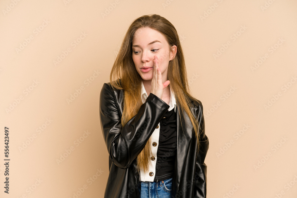 Young redhead woman cut out isolated is saying a secret hot braking news and looking aside Young redhead woman cut out isolated is saying a secret hot braking news and looking aside