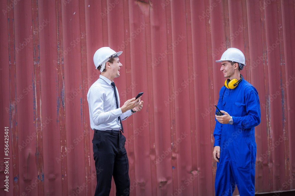Industrial engineer and inspector or safety supervisor working in container terminal,Container in export and import business and logistics. Industrial engineer and inspector or safety supervisor working in container terminal,Container in export and import business and logistics.