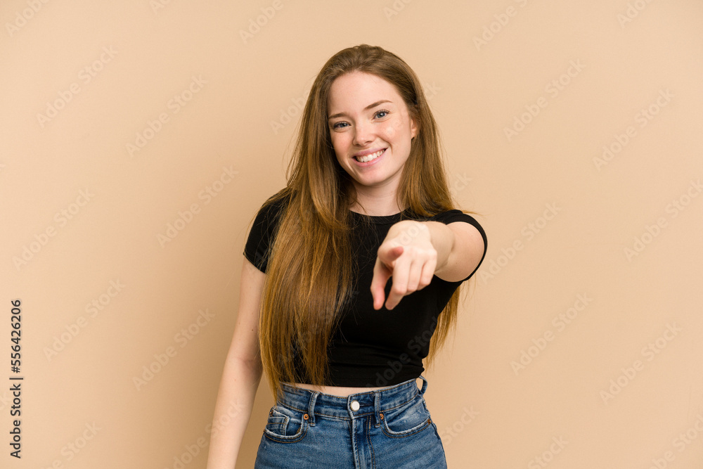 Young redhead woman cut out isolated cheerful smiles pointing to front. Young redhead woman cut out isolated cheerful smiles pointing to front.