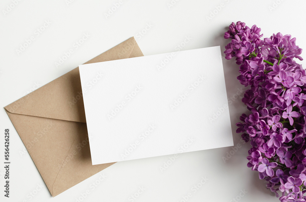 Blank wedding invitation card mockup with envelope and spring lilac flowers Blank wedding invitation card mockup with envelope and spring lilac flowers