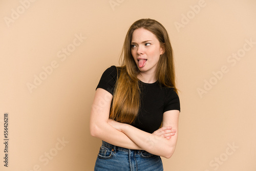 Young redhead woman cut out isolated funny and friendly sticking out tongue.
