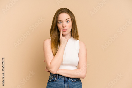 Young redhead woman cut out isolated having some great idea, concept of creativity.