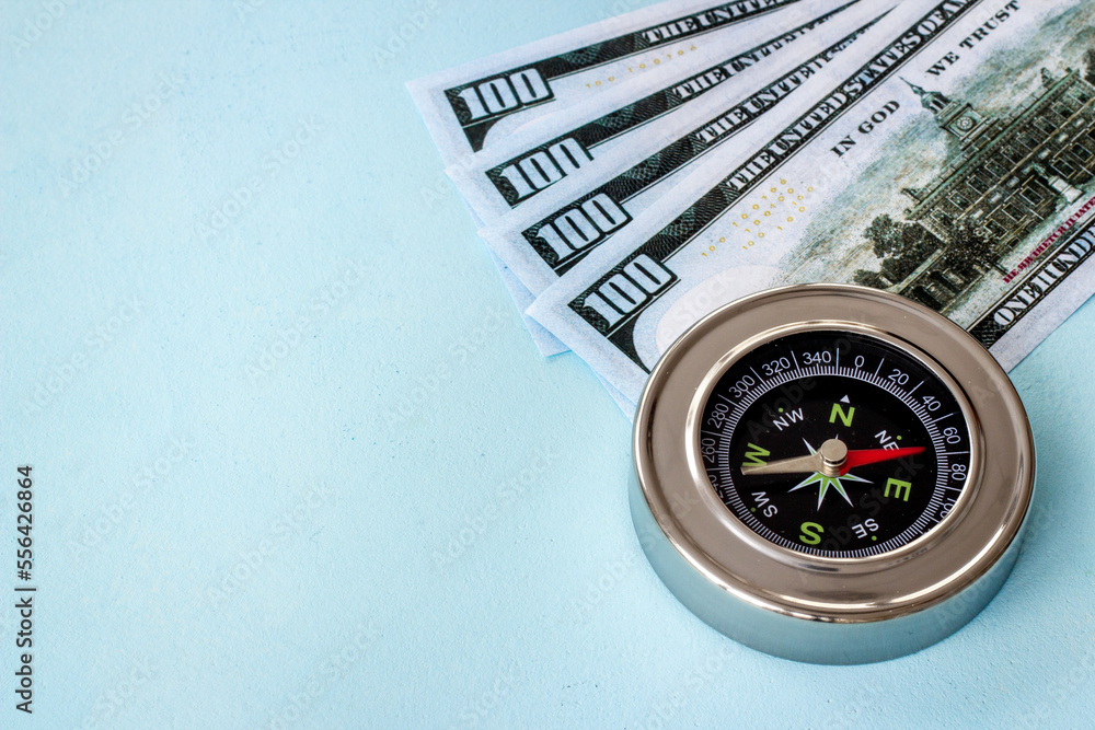 Compass and money cash - exchange rate change concept Compass and money cash - exchange rate change concept