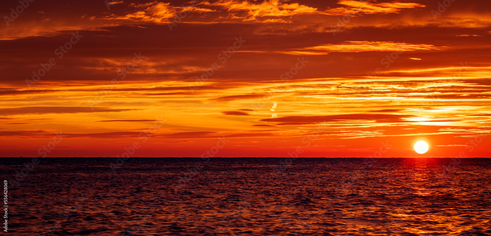 Amazing rising sun at sea horizon
