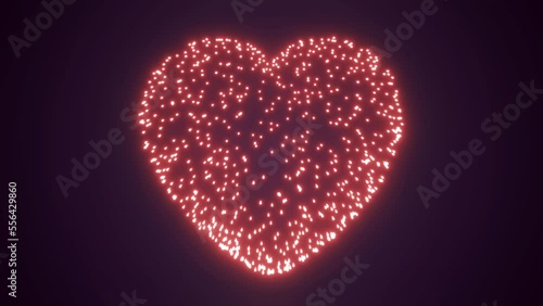 Abstract fireworks festive saluk for valentine's day in the shape of a heart from glowing bright particles and magical energy lines. Abstract background. Video in high quality 4k, motion design photo