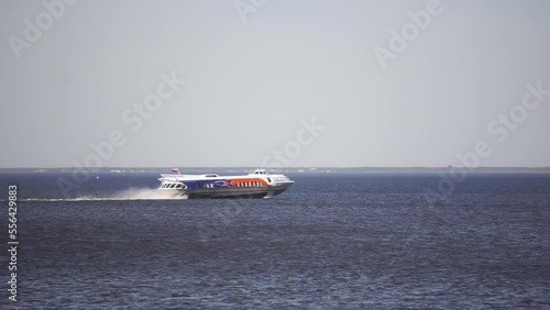Meteor jet boat with tourists at water surface. Footage. Water transport isolated.