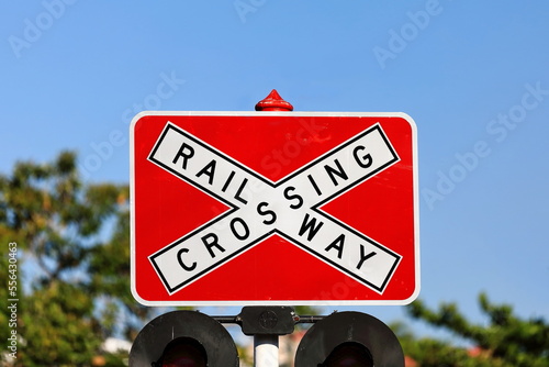 R6-25 Railway Crossing with red backing board road sign. Florence Street-Cairns-Australia-361 photo