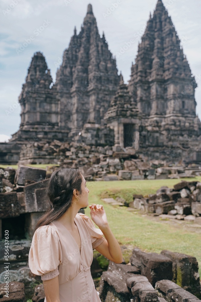 Fototapeta premium vertical model posing at prambanan temple, yogyakarta, indonesia