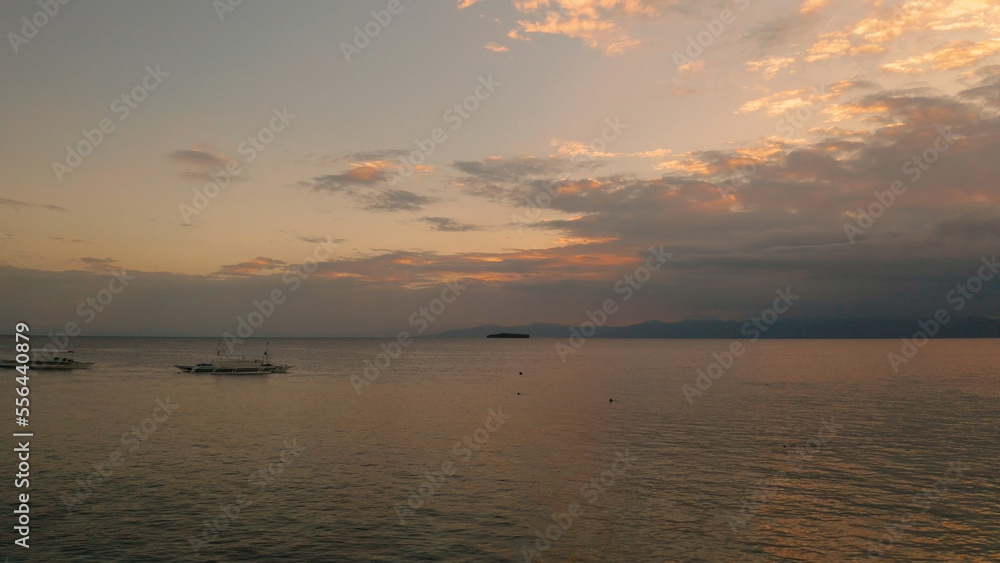 Beauty of colorful sky during the sunset from above. Beautiful sunset background from the colorful beams on the sky. Sunset over ocean. Seascape, Summer and travel vacation concept Beauty of colorful sky during the sunset from above. Beautiful sunset background from the colorful beams on the sky. Sunset over ocean. Seascape, Summer and travel vacation concept