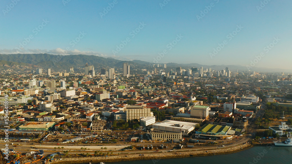 Cityscape: Cebu city with modern buildings, skyscrapers and business centers, top view during sunrise. Philippines.