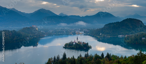 Aerial landscape photography. Colorful morning scene of Pilgrimage Church of the Assumption of Maria. Aerial autumn view of Bled lake, Julian Alps, Slovenia, Europe. Traveling concept background. photo