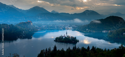 Aerial landscape photography. Colorful morning scene of Pilgrimage Church of the Assumption of Maria. Aerial autumn view of Bled lake, Julian Alps, Slovenia, Europe. Traveling concept background. photo