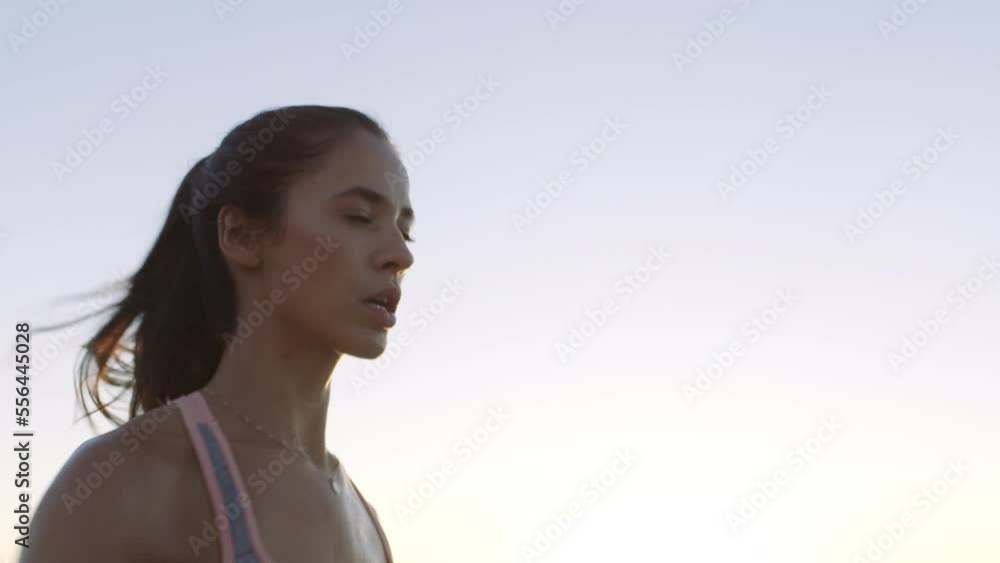Fitness, running and woman on beach with energy, speed and focus training for marathon, body goals or progress with morning and ocean waves. Sports exercise, fast runner or athlete workout by the sea Fitness, running and woman on beach with energy, speed and focus training for marathon, body goals or progress with morning and ocean waves. Sports exercise, fast runner or athlete workout by the sea