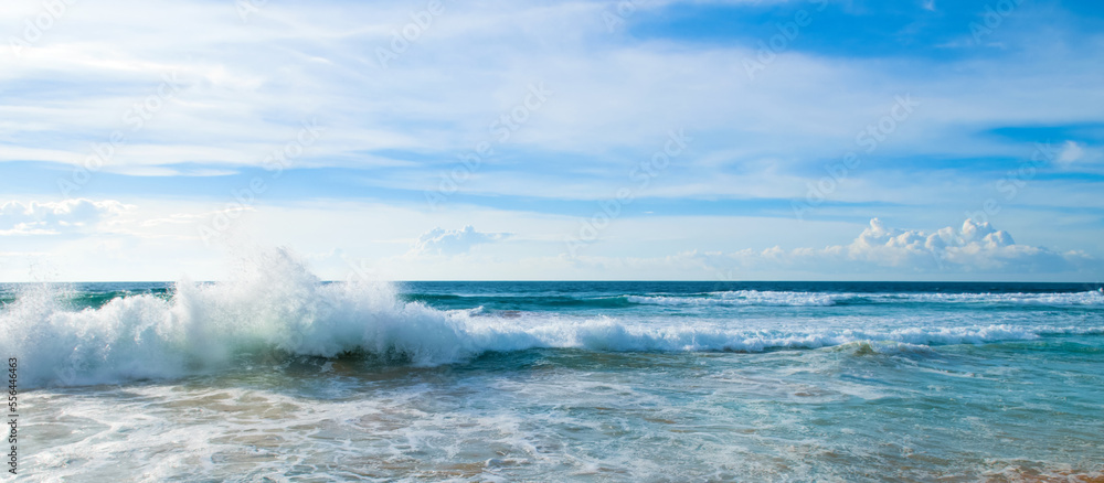 Beautiful tropical sea and sun on blue sky background. Wide photo. Beautiful tropical sea and sun on blue sky background. Wide photo.