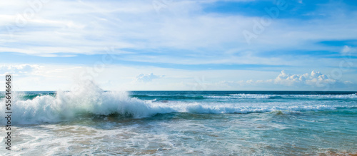 Beautiful tropical sea and sun on blue sky background. Wide photo.