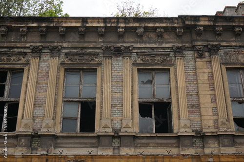 Abandoned old house. Frieze, windows with broken glass. Bytom, Poland.