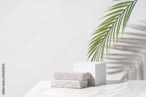 Empty podium for cosmetics beauty product presentation. Made with pumice stone on a bathroom table. Front view.